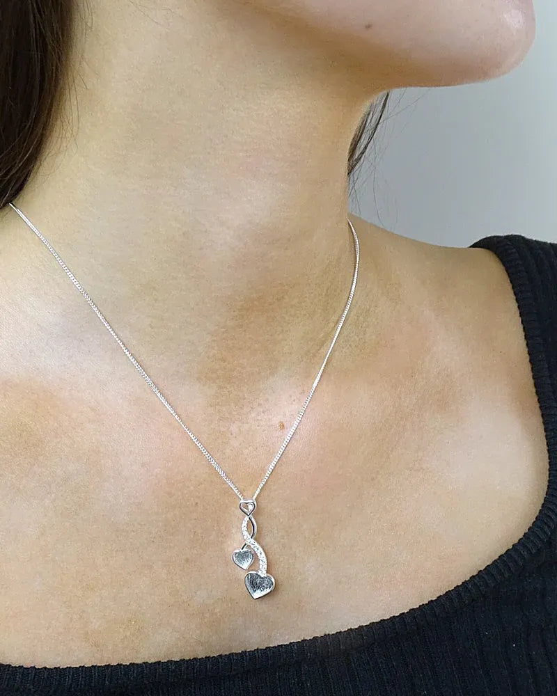 Sterling Silver CZ entwined hearts Pendant