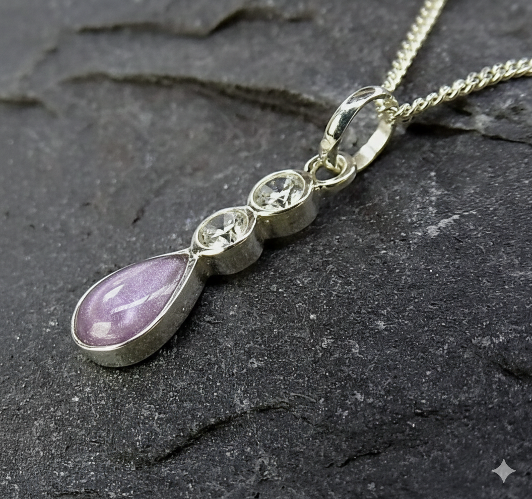 Sterling Silver CZ Memorial ashes, hair or fur Teardrop Pendant Silver pendant necklace featuring a teardrop purple stone and two clear gemstones above it.